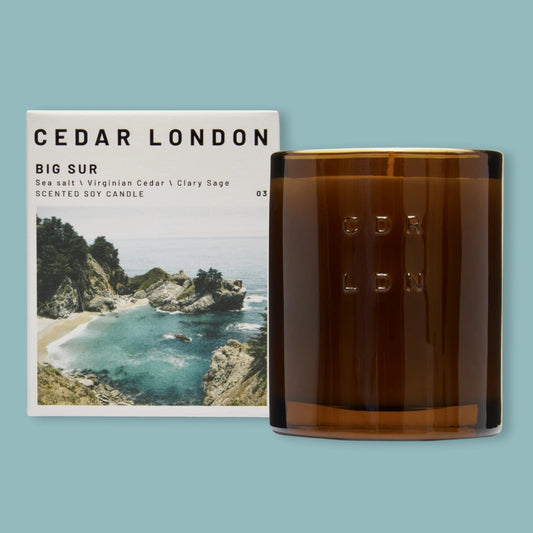 Cedar London Big Sur candle and packaging on a light blue background
