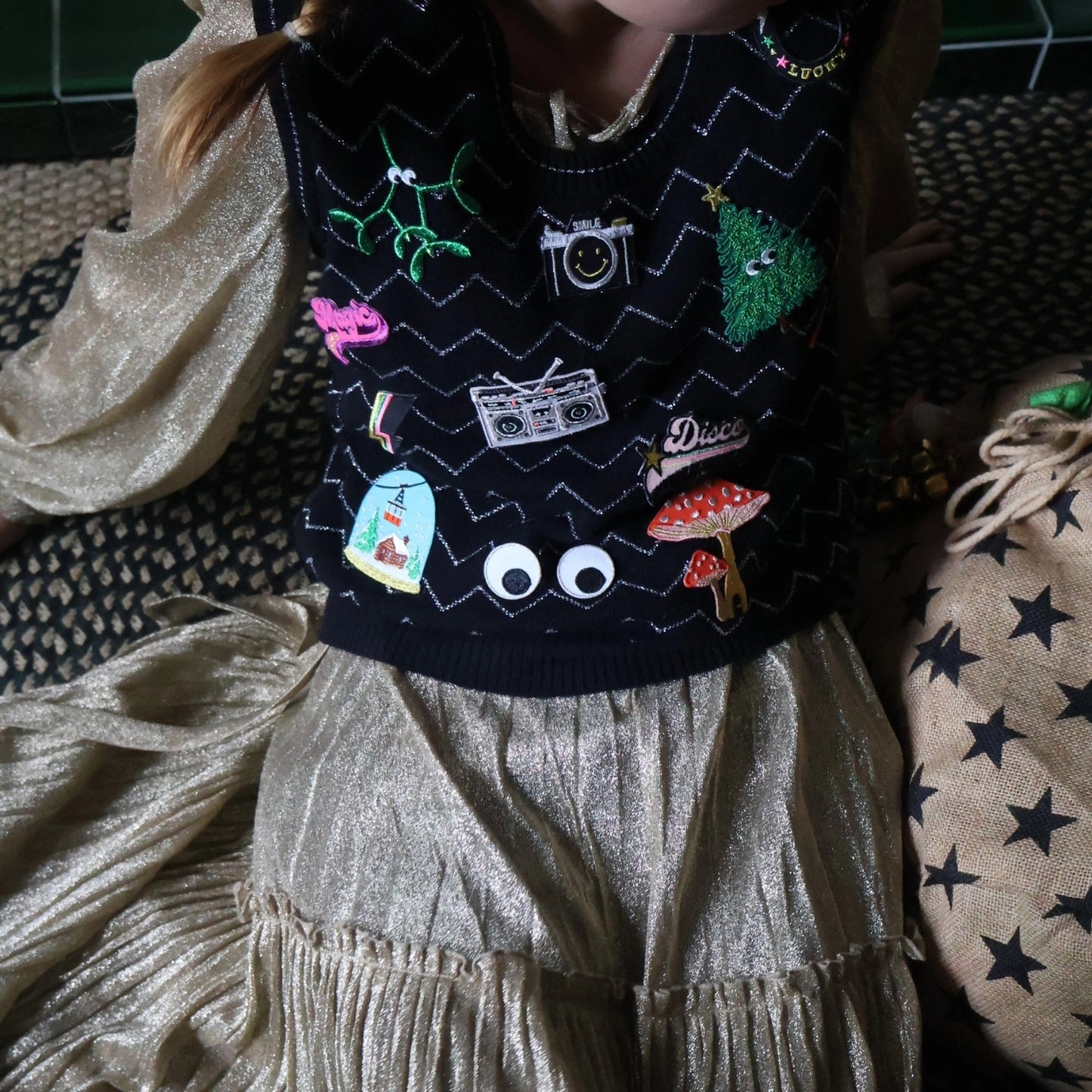 Petra Boase patches worn by a model weating a sweater.