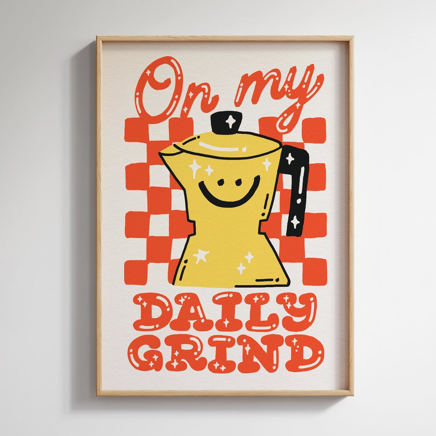 Framed artwork with a yellow coffee pot and red text on a checkered background.