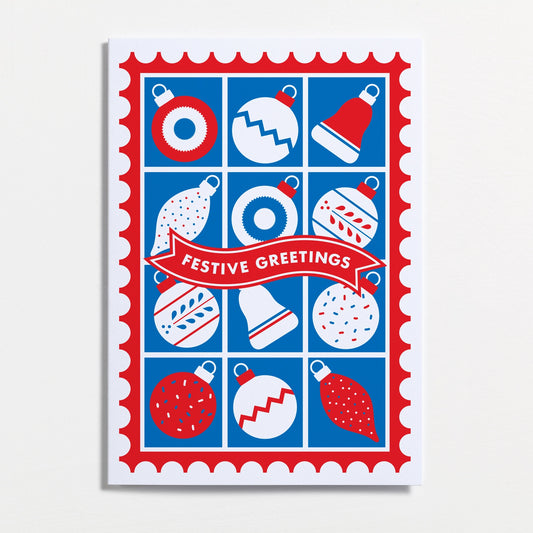 Festive greetings card with Christmas ornaments on a blue background