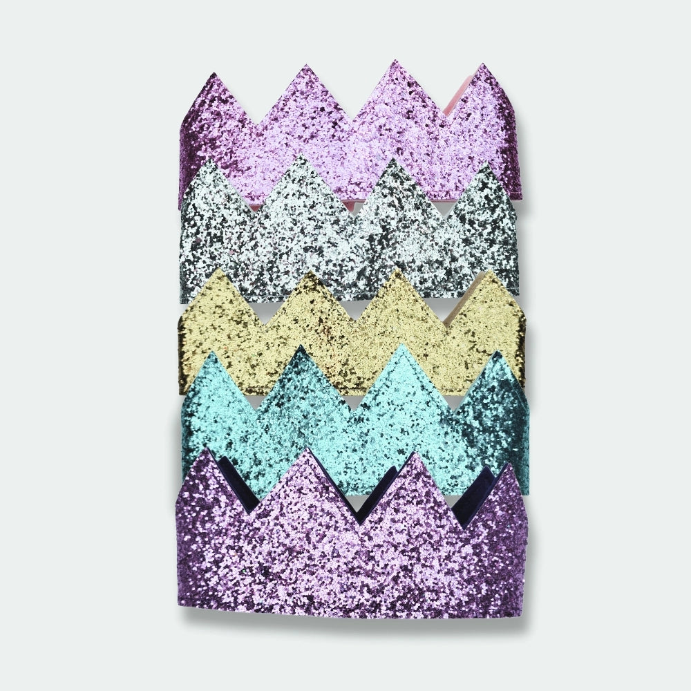 Colourful sequin crowns with a zigzag pattern on a white background