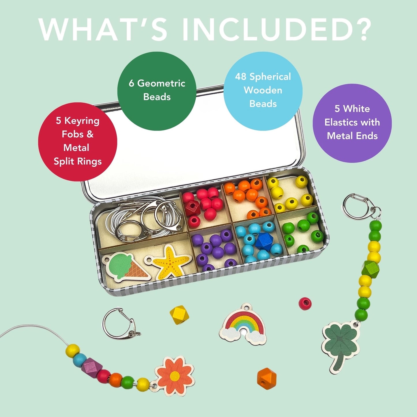 Beading kit with geometric beads, keyring fobs, and elastics on a light green background