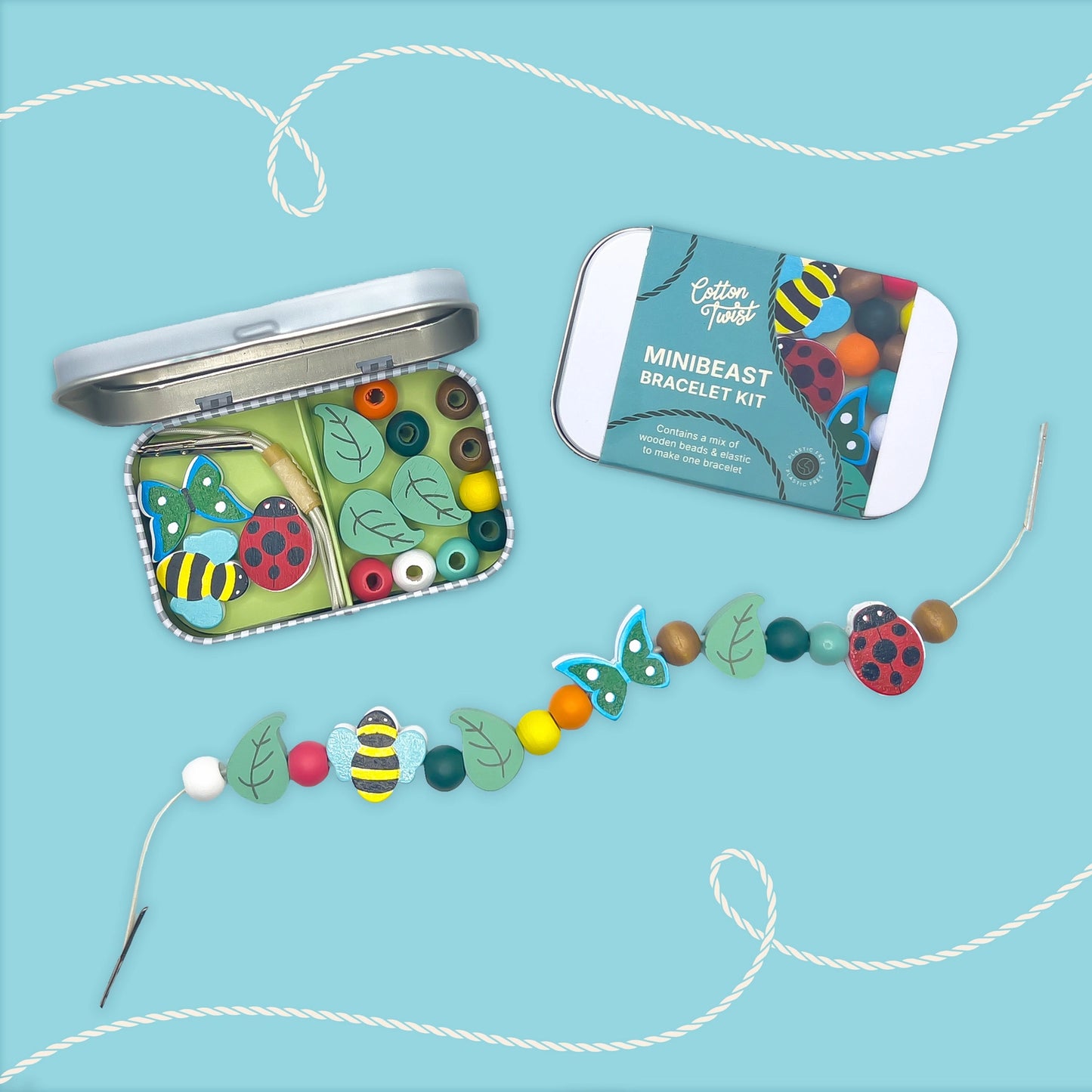 Minibeast bracelet kit with beads and tools on a blue background