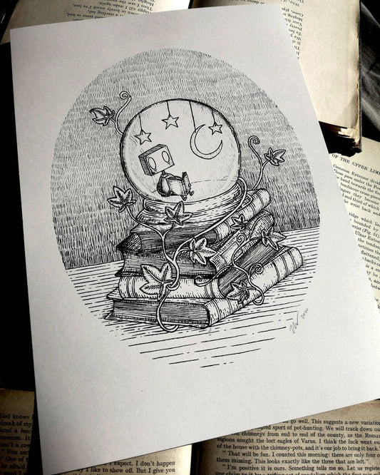 A white print with a black and white illustration of a little robot reading inside a starlit snowglobe on a stack of books.