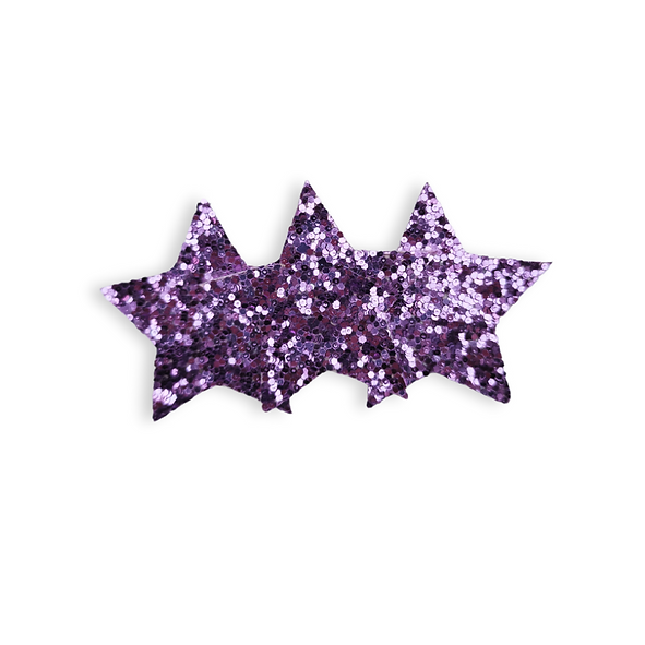 Purple glittery star-shaped hairclip on a white background