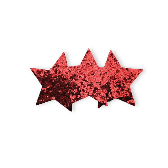 Red glittery star-shaped hairclip on a white background