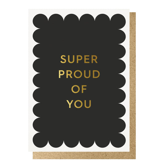Gold foil text reads 'Super Proud of You' on a black scalloped background, on white card. With brown envelope.