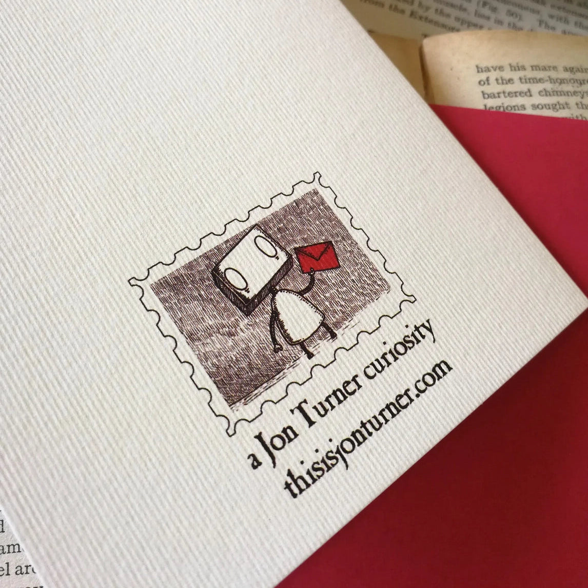 Reverse of white card wih stamp inspired illustration of a robot with an envelope.