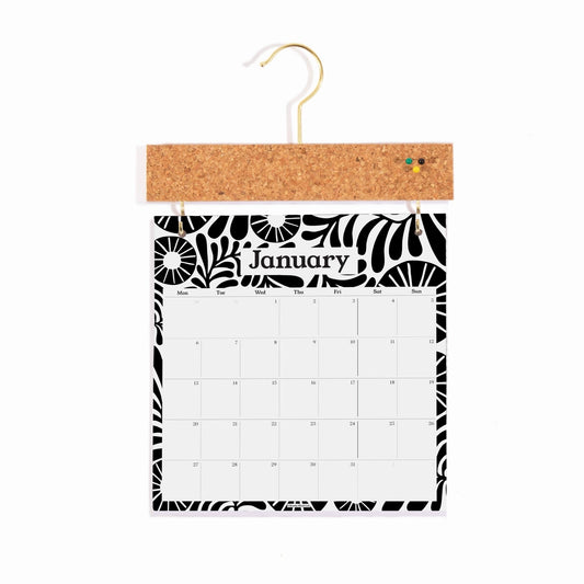 Monochrome wall calendar with a pinbord hanger. Showing the month January.