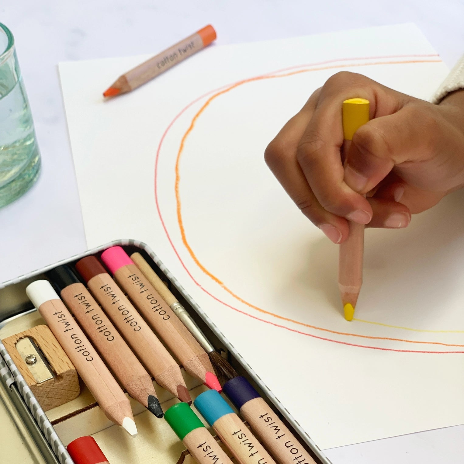 Coloring with colored pencils on a white sheet of paper