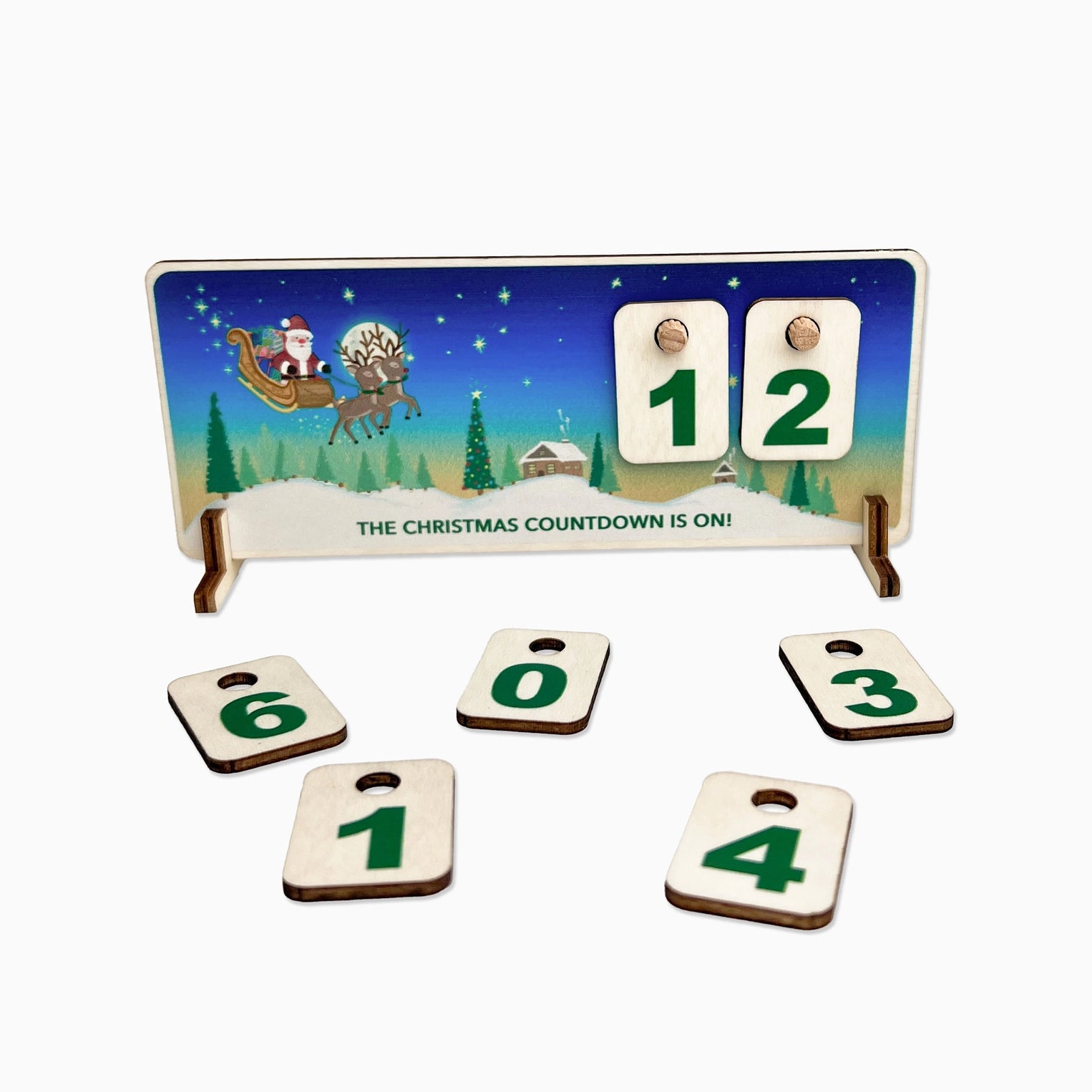 Christmas countdown calendar with Santa and reindeer illustration on a stand.
