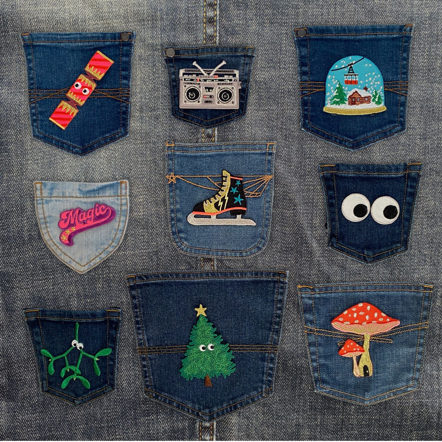 Denim pockets adorned with Petra Boase iron on patches, including the Christmas Cracker, tree, stereo, mushroom and more.