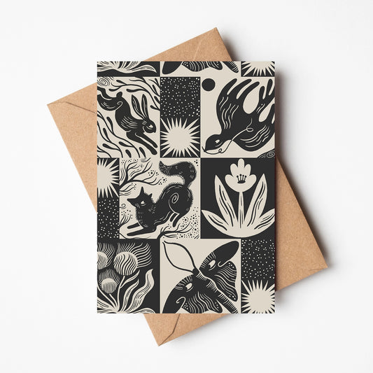 Card with handrawn black and white animal and nature pattern on a white background