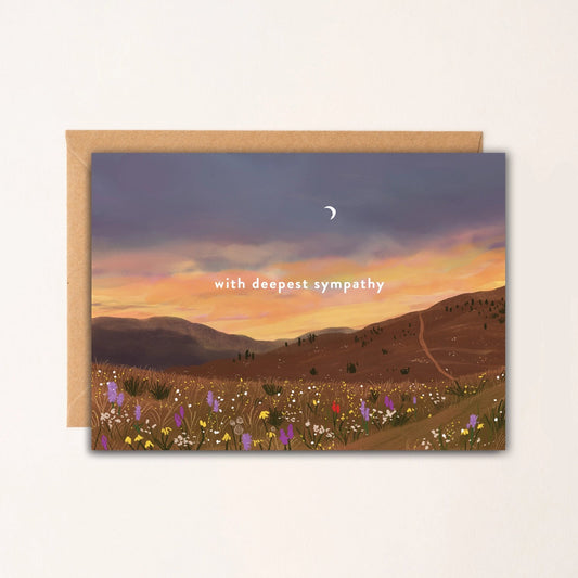 Greeting card with a sunset over a field of flowers and 'with deepest sympathy' text.