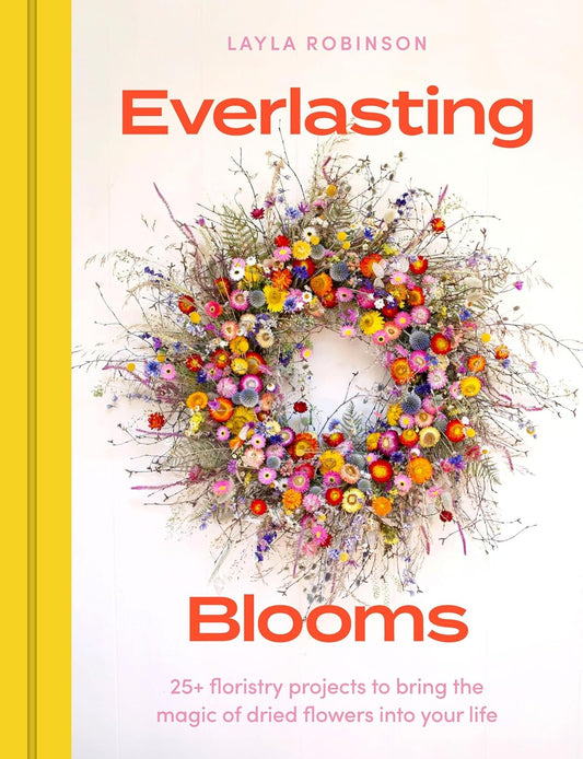 Front cover of Everlasting Blooms hardback book with a dried flower wreath i the centre and orange lettering.