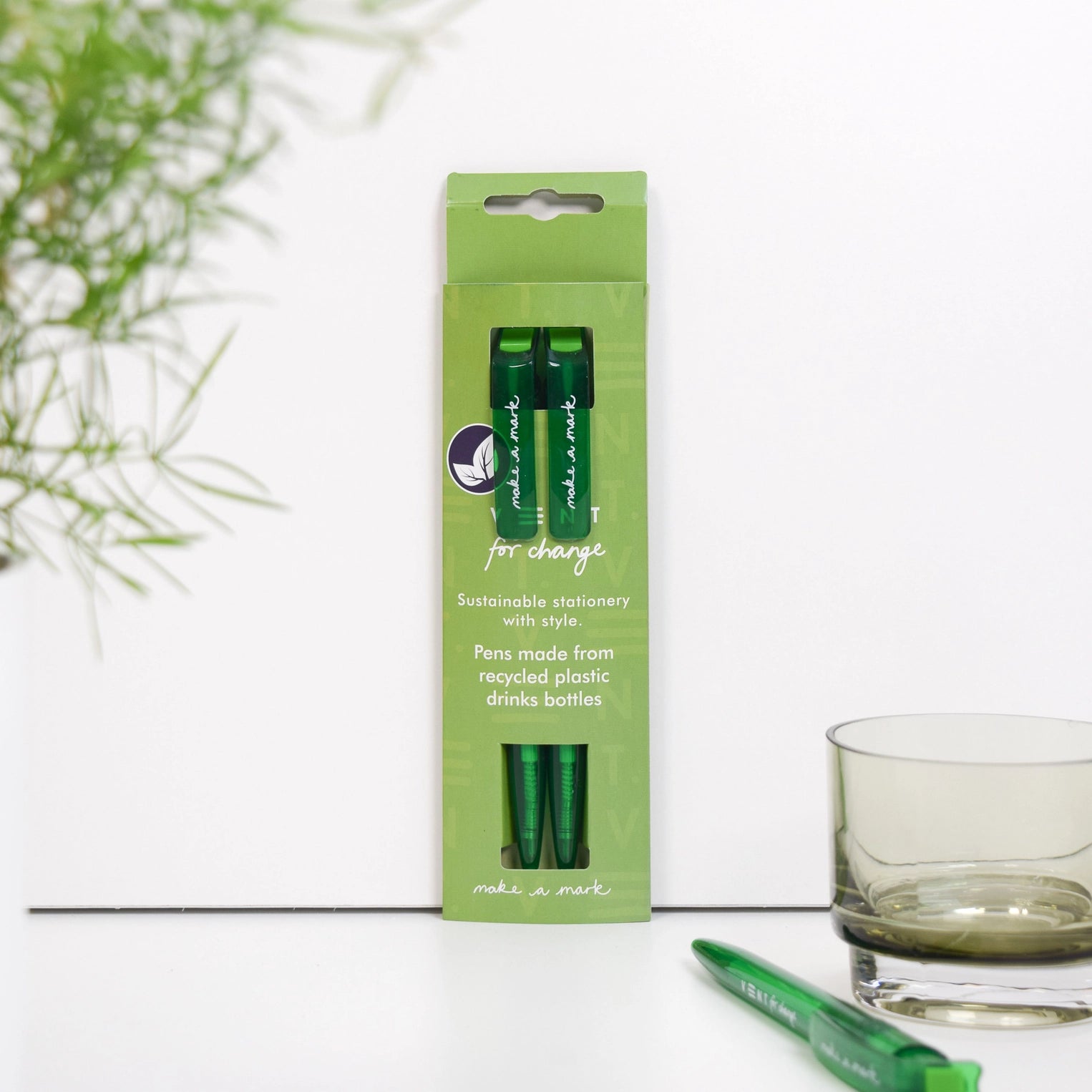 Pack of two black ball point pens made from recycled plastic, in a green sleeve.