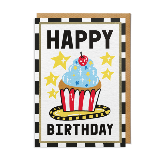 Illustrated birthday care featuring a blue iced cupcake with a cherry on top and yellow stars. With a black and white striped border and brown kraft envelope.