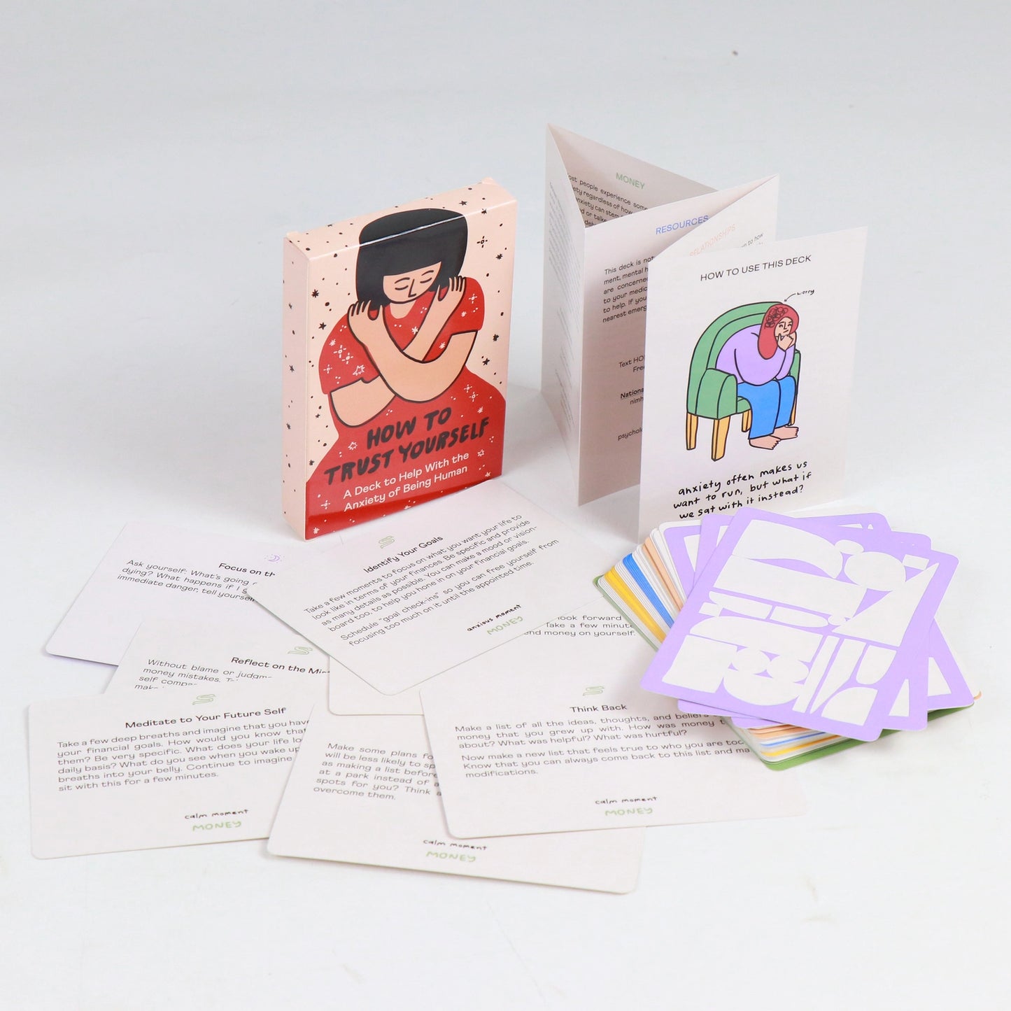 Set of cards and 'how to use' guide on a white surface with illustrations and text.