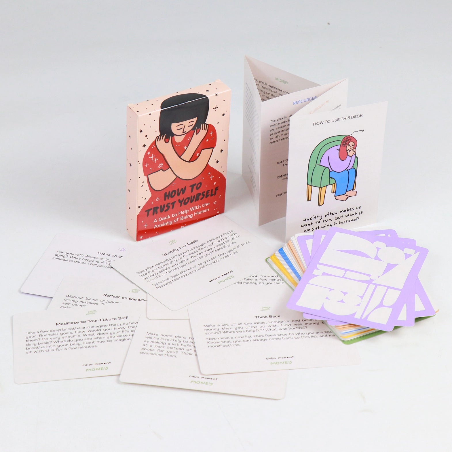 Set of cards and 'how to use' guide on a white surface with illustrations and text.
