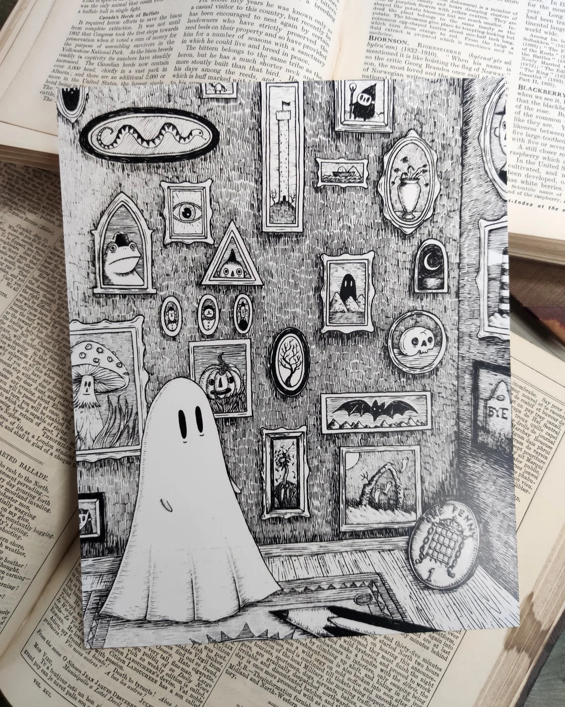 Black and white illustration of a ghost admiring his room of curiosities, with a wall filled with spooky framed pictures.