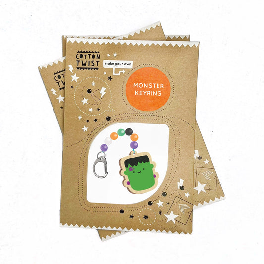 Cotton Twist craft kit for making a monster keyring on a white background