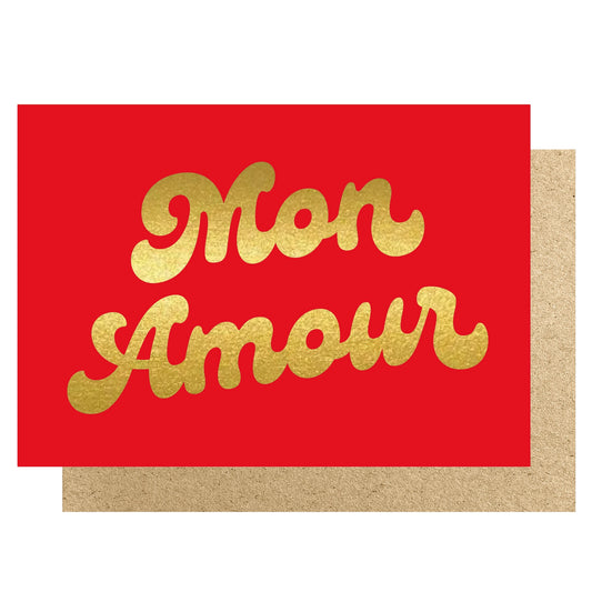Red greeting card with the words Mon Amour in gold foil.