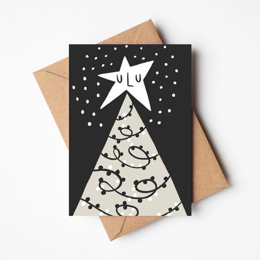 Sleeping star on top of a christmas tree in the nighttime. Handrawn illustrated, monochrome card with a brown envelope.