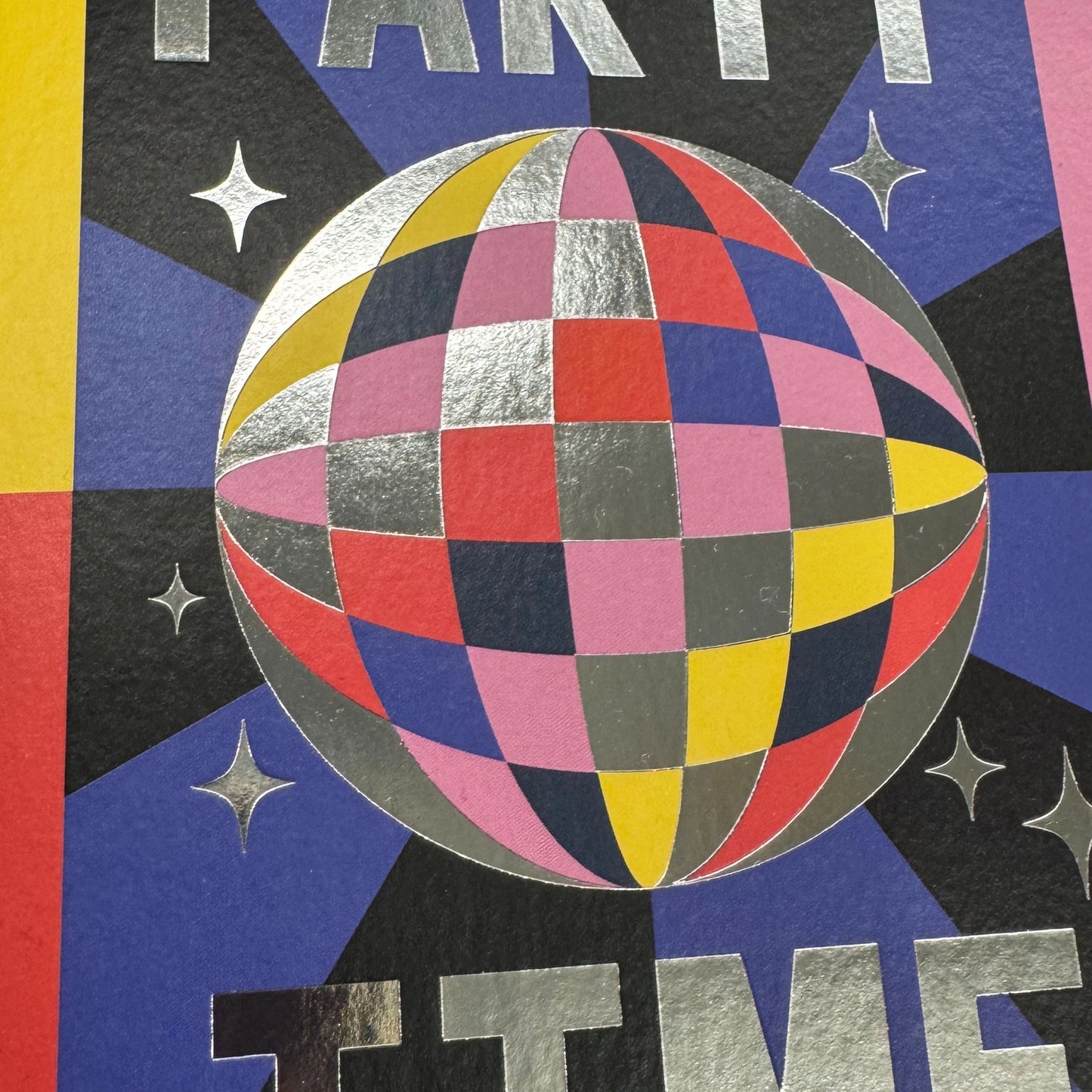 Colorful geometric sphere with stars and text on a multicolored background