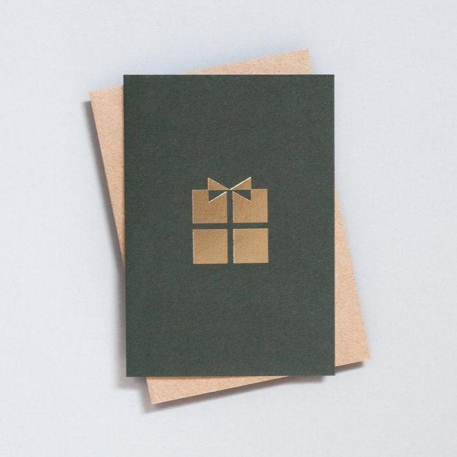 Brass foiled present motif on dark green card with brown kragft envelope.