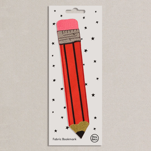Fabric bookmark shaped like a red pencil on a white card with star patterns