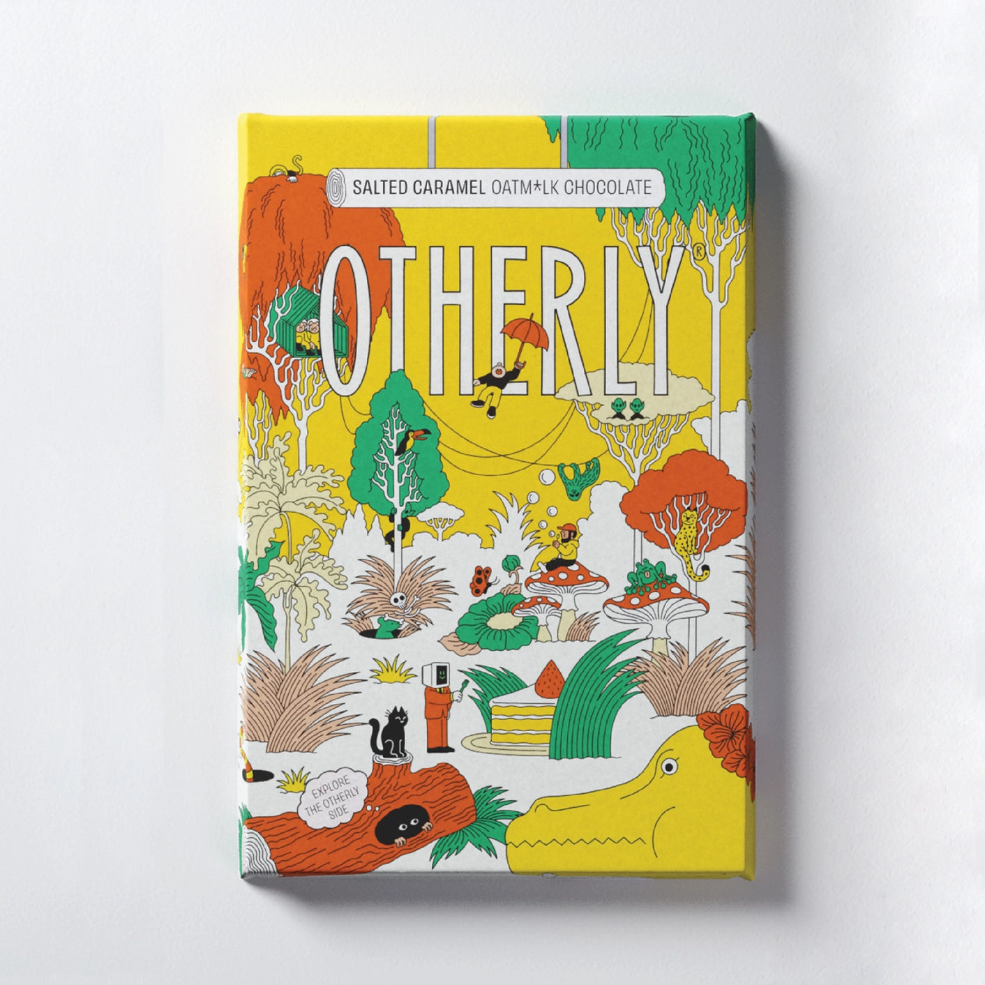 Creamy vegan oat milk chocolate bar wrapped in an illustrated wrapper featuring a wilderness with an array of characters, mushroom, trees, & animals.